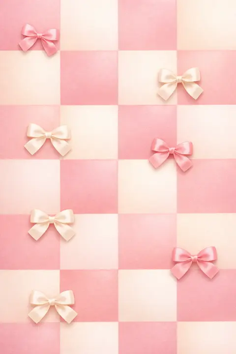 Cute pastel wallpaper with a soft checkerboard pattern and small satin bows on the squares