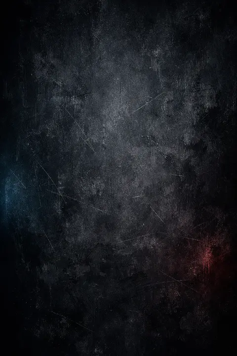 Dark grunge wallpaper with a scraped stained concrete wall texture in uneven shadow