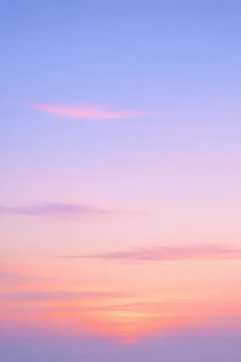 Pastel sunset wallpaper in coral, powder blue and pale lilac with soft low contrast gradients