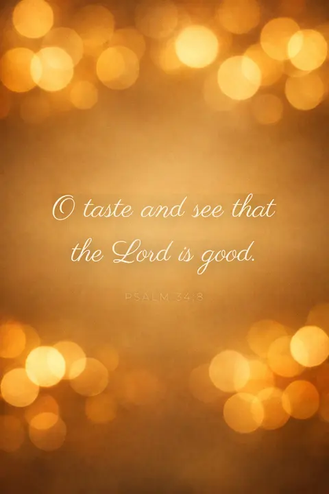 Bible verse wallpaper with Psalm 34:8 in script lettering over warm honey and amber bokeh light